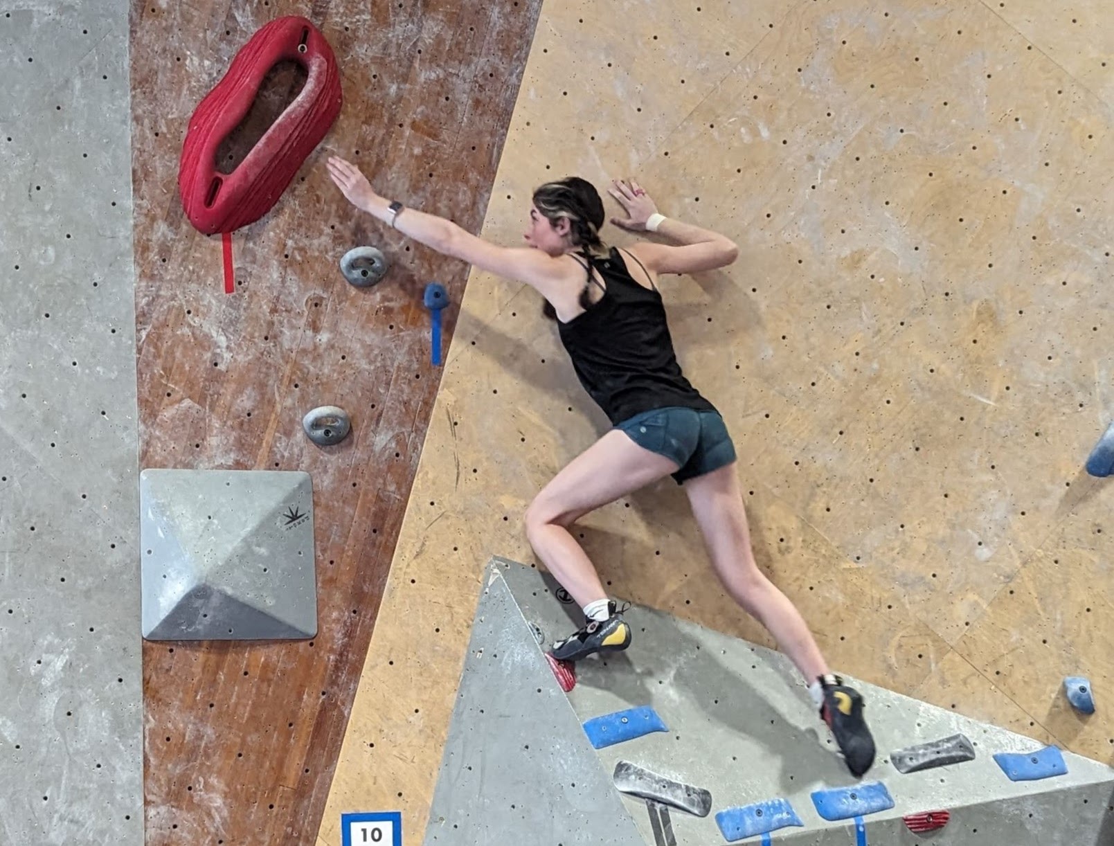 climber reaching for goal